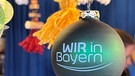 Die "Wir in Bayern"-Christbaumkugel am Sternstundenstand auf dem Nürnberger Christkindlesmarkt | Bild: BR