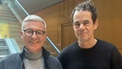 BR-Kinoexperte Markus Aicher mit dem Filmregisseur Tom Tykwer  | Bild: (c) Markus Aicher