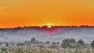 Es ist 05.25 Uhr früh, ein Genuss, den tollen Sonnenaufgang mit zu erleben, im Grunde noch Frühnebel. Unten links, Memmelsdorf und darüber die aufgehende Sonne, toll! | Bild: Ottmar Müller, Obermerzbach, 24.06.2024