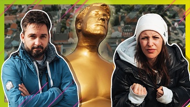 Sebastian Meinberg und Julia Nageler neben einer Marc Seibold Statue | Bild: BR