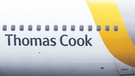 Ausschnitt von einem Flugzeug mit der Aufschrift "Thomas Cook" | Bild: dpa/picture alliance