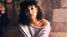 Alex (Jennifer Beals, die Protagonistin des Films "Flashdance" blickt in die Kamera. | Bild: picture alliance/United Archives | United Archives/Impress